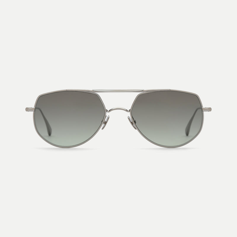AHLEM Cadet sunglasses in 22k electroplated ruthenium brushed metal with green gradient lenses, front view.